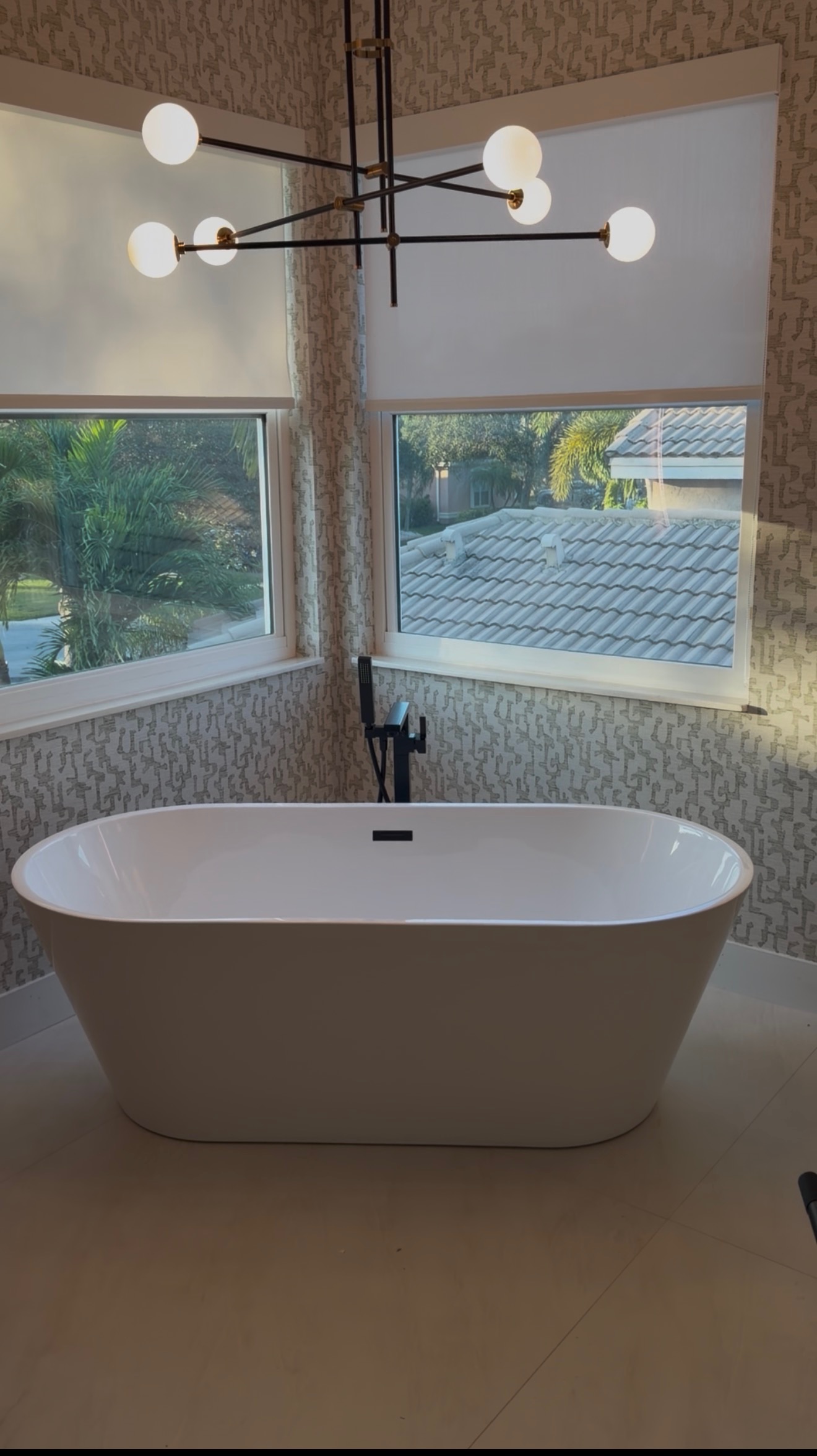 Freestanding Tub with Modern Chandelier project by Worldwide Floors Corp in Miami-Dade or Broward