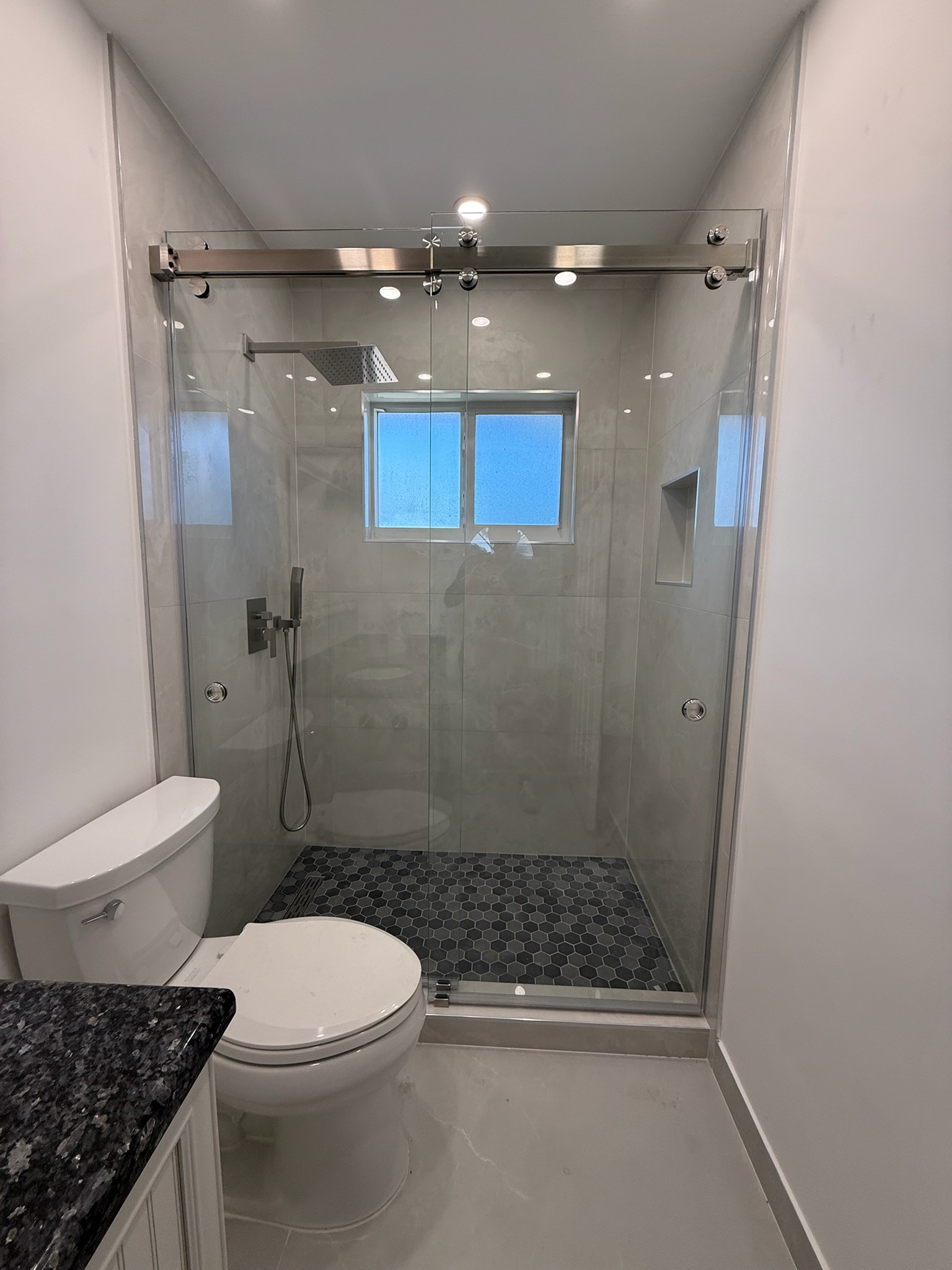 Bathroom Hex Tile Shower project by Worldwide Floors Corp in Miami-Dade or Broward